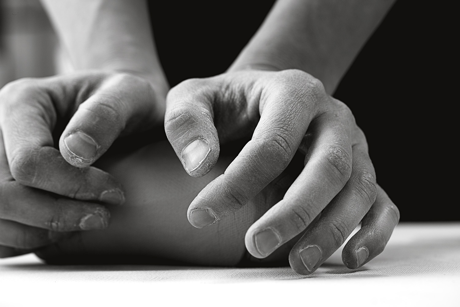 Lifestyle photography of kneading clay ball at ceramics studio  — Studio 3, Inc.