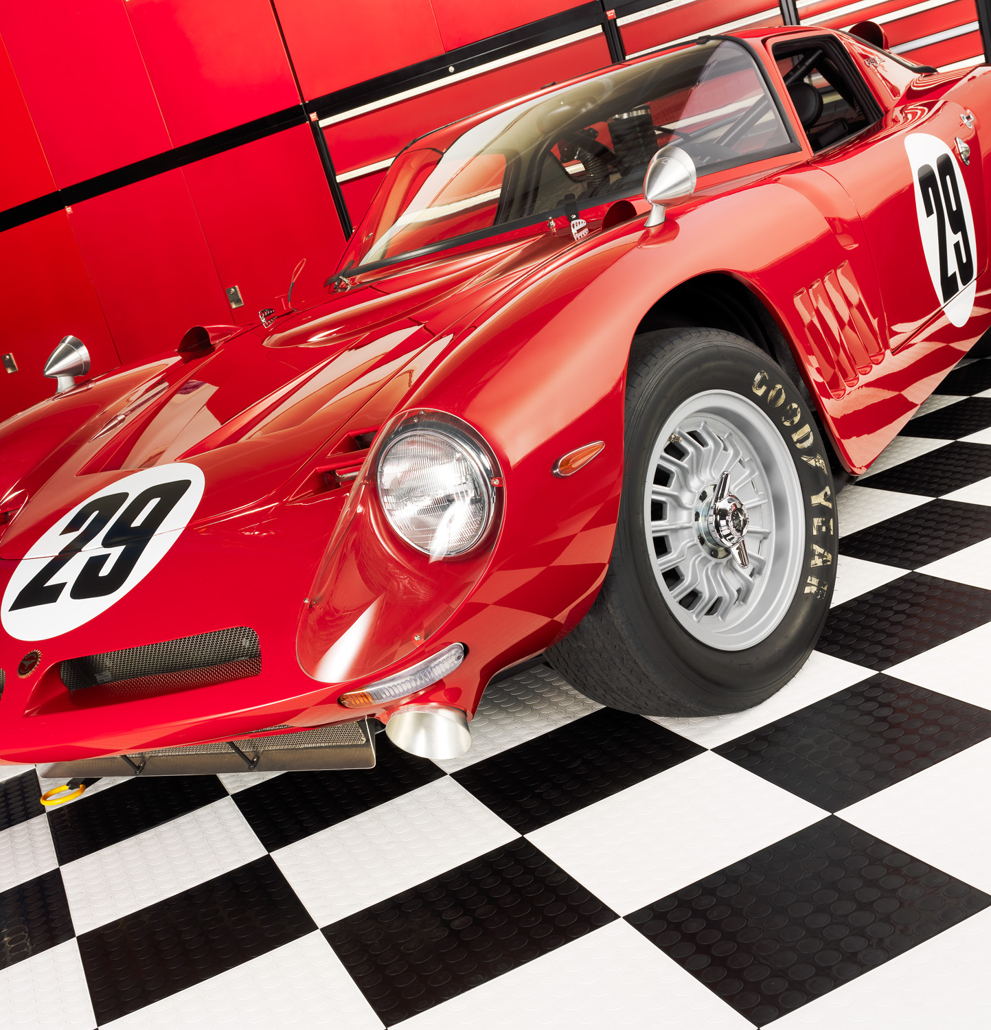 Red 29 race car on checkered floor mats for Griots Garage  — Studio 3, Inc.