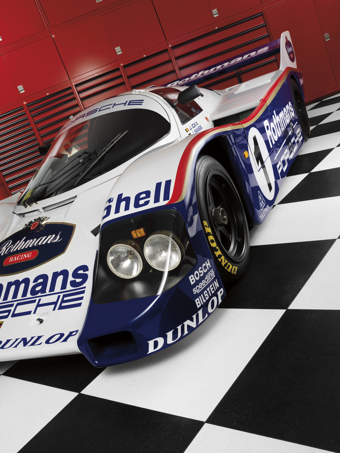 Porsche 956 race car on checkered floor for Griots Garage   — Studio 3, Inc.