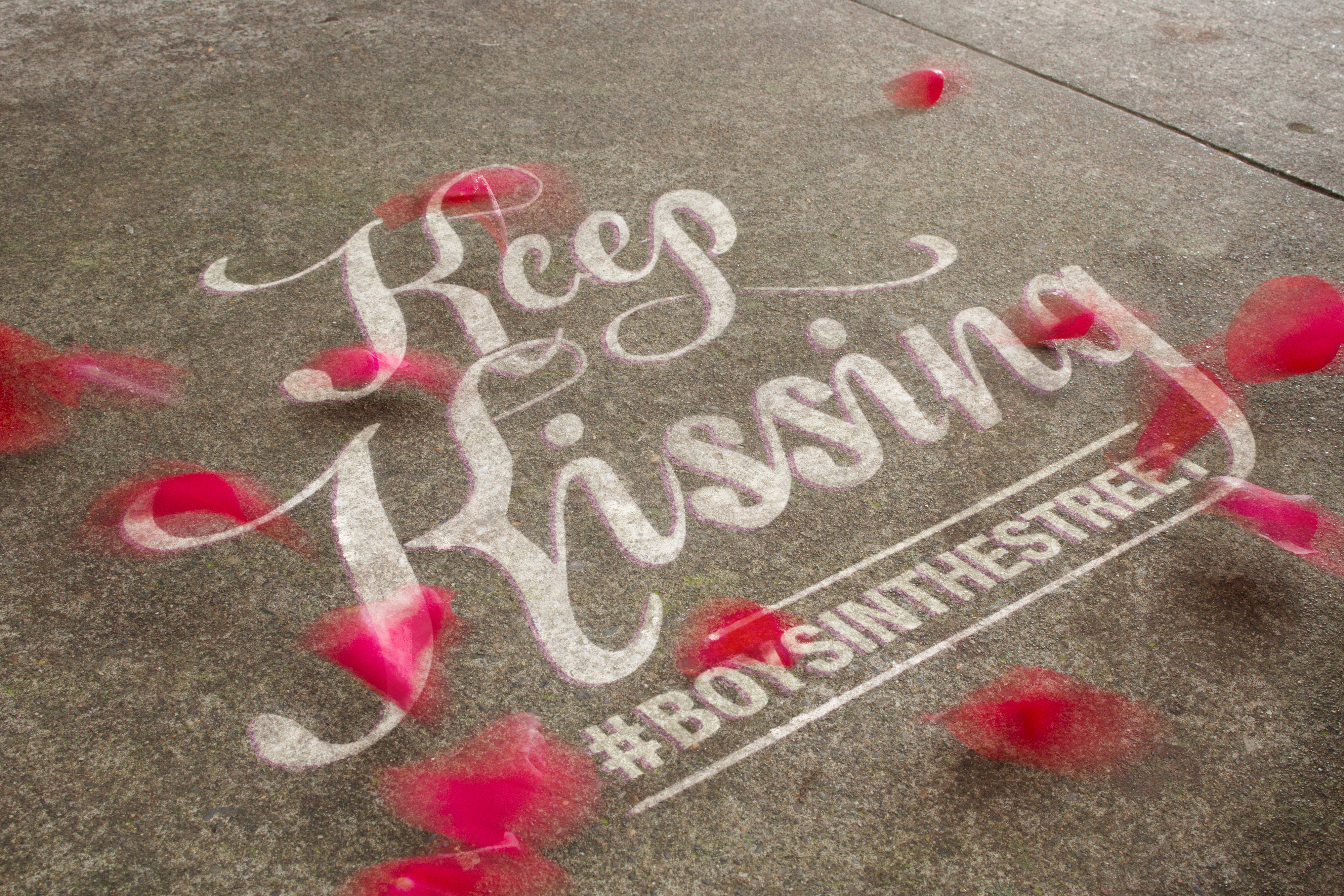 Keep Kissing Boys on the Street song title graffiti art with rose petals  — Studio 3, Inc.