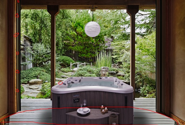 Tea set on table on wooden patio in zen garden