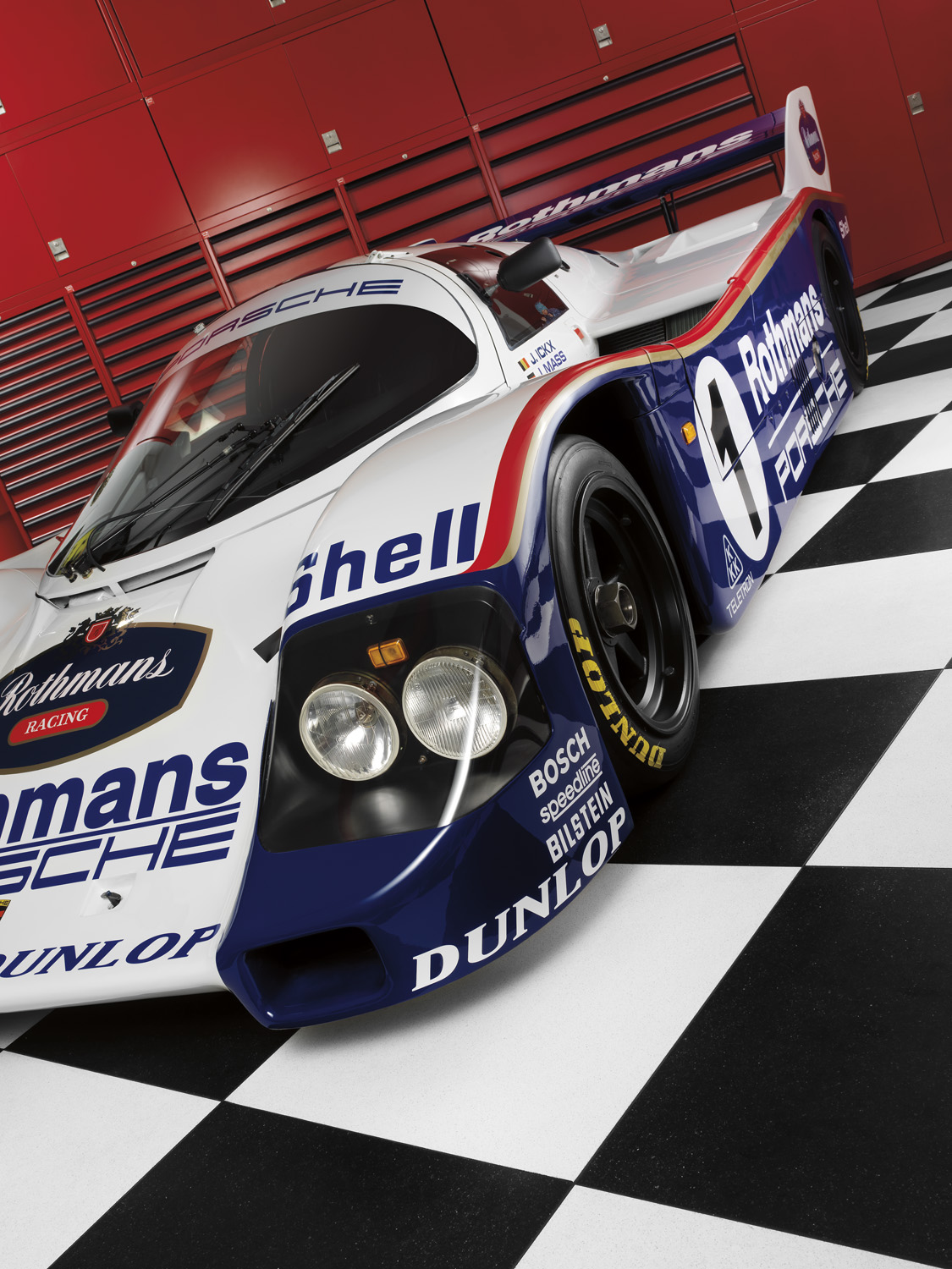 Porsche 956 race car on checkered floor for Griot's Garage 